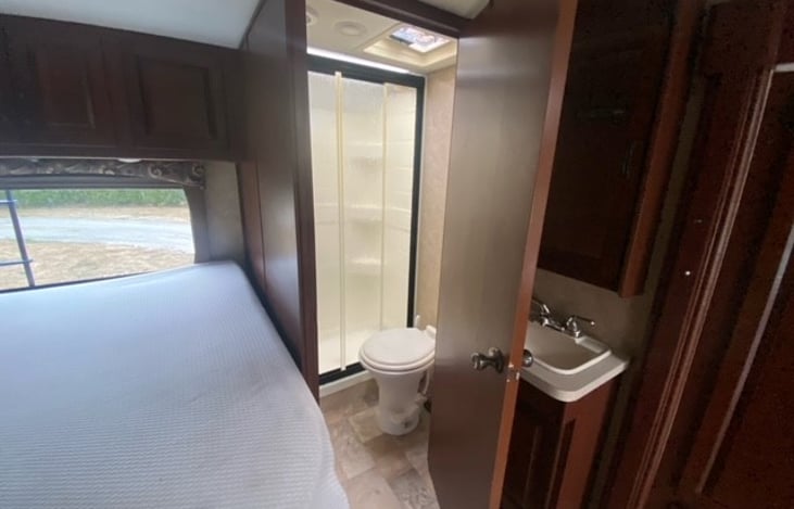 Private toilet and shower. Second sink located outside of bathroom. Very convenient for kids to wash up for meals without blocking up the kitchen sink.