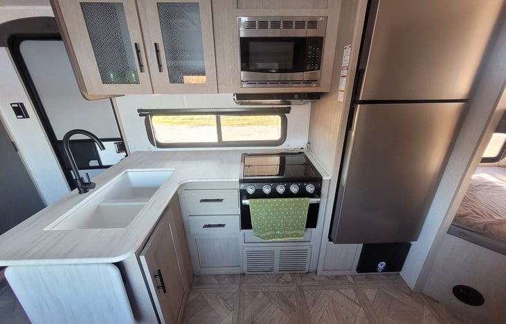 Kitchen. Including double sink, microwave, refrigerator, stove and oven.