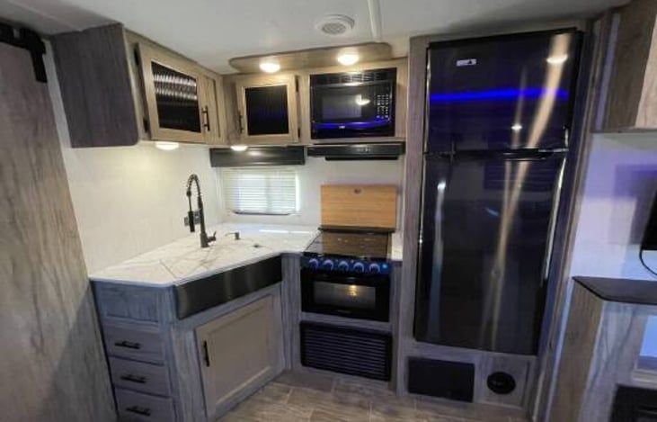 Roomy kitchen stocked with plenty of utensils, cooking supplies and more!