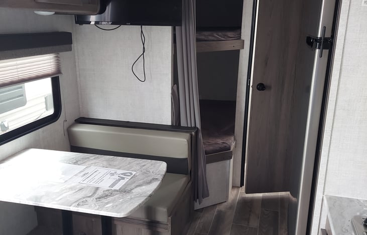 Dining table that folds into double bed