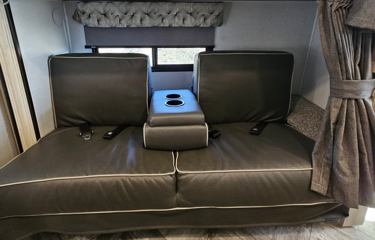 Kids sofa with cup holders' arm and sit belts