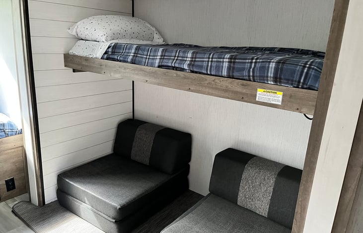 Bunk room. Gaming chairs fold out into beds