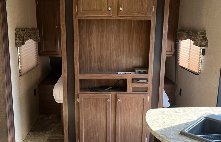 Entertainment Center that will have a 32" TV where you can hook to cable, watch DVDs or connect gaming system.