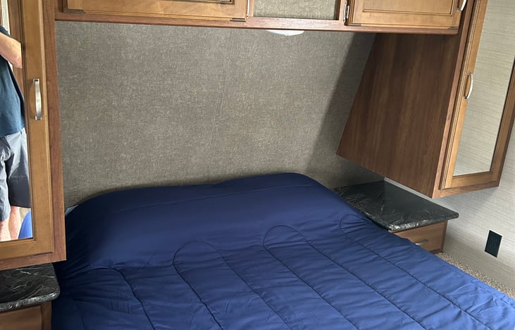 Queen sized bed with two closets.