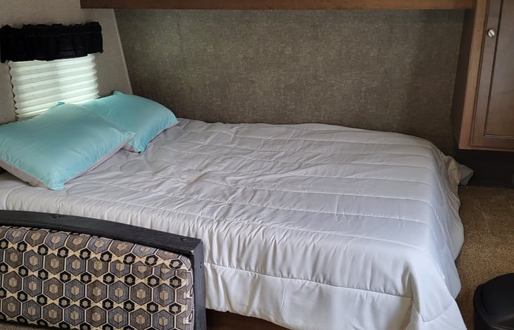 Full sized bed. Camper comes fully stocked with linens, pillows, and blankets.