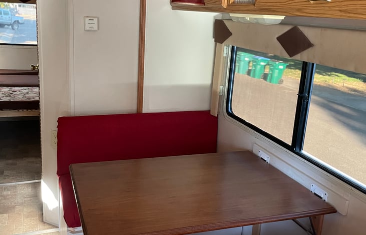 Dinette that folds down if needed for an extra bed.