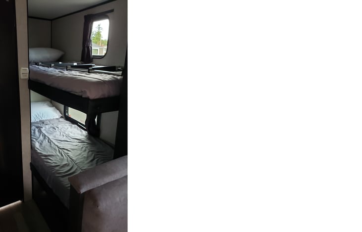 Bunk Beds with standard bed on top and added memory foam on the bottom bunk.