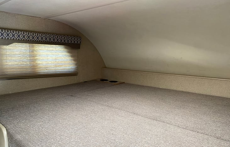 Full-sized bunk above the driving area - great for sleeping and also for storage.