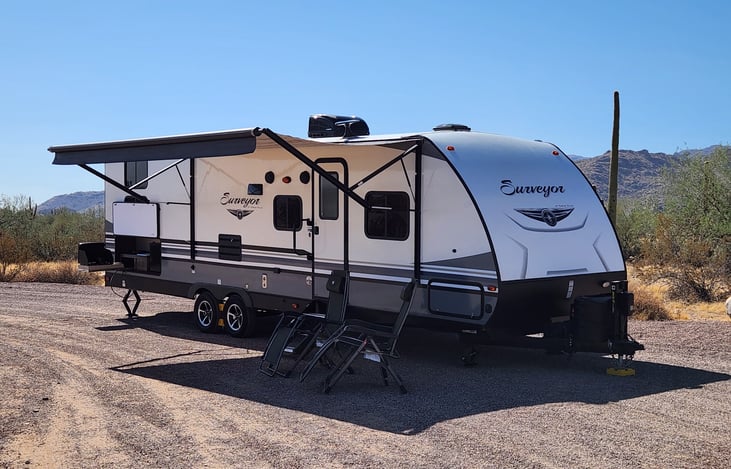 Camp side with Outdoor Kitchen and 16' awning extended. 2 reclining folding chairs for your comfort.