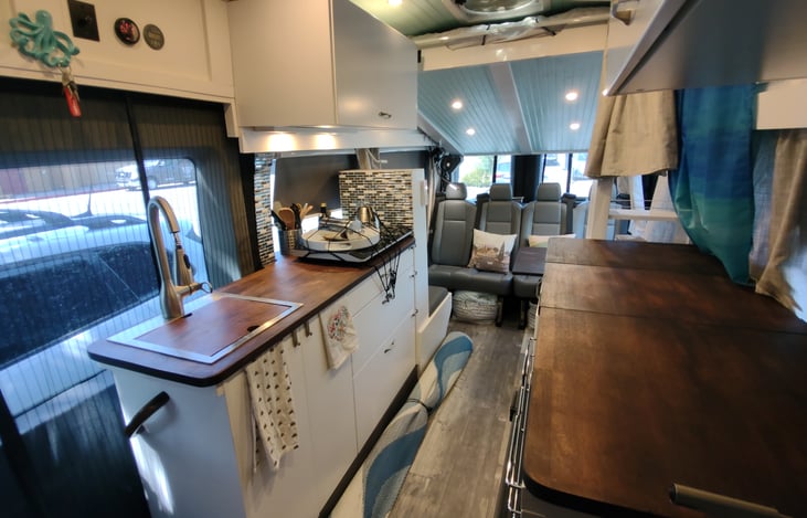 Notice "master bedroom" above seating/dining/2nd bedroom.  Folds up into the ceiling.