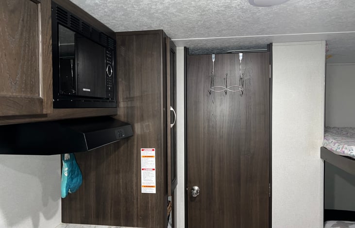 Microwave + pantry to the right