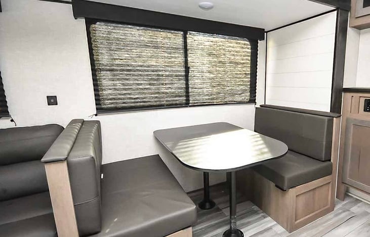 Dinette that turns into bed and has storage underneath seats