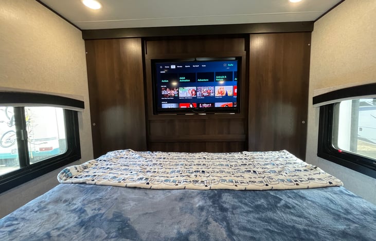 The TV in the living room will spin around so you can watch it in the bedroom.