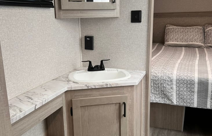 Large walk through bathroom with pockets doors.