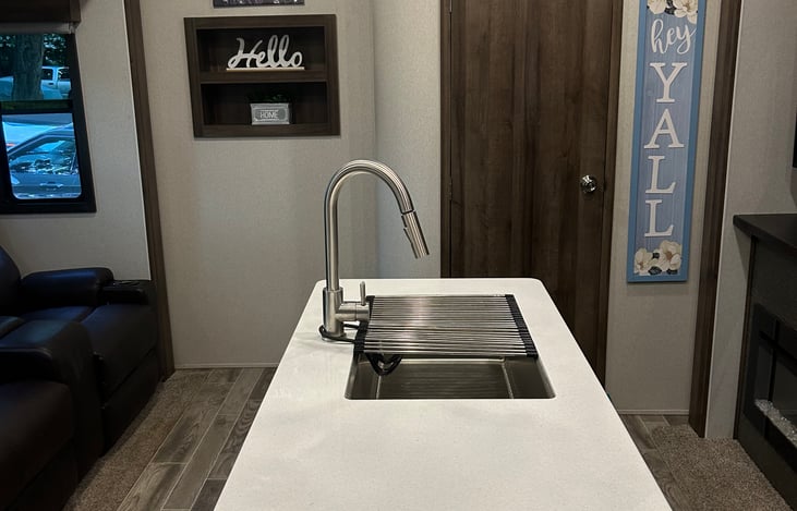 Kitchen and living area with island.