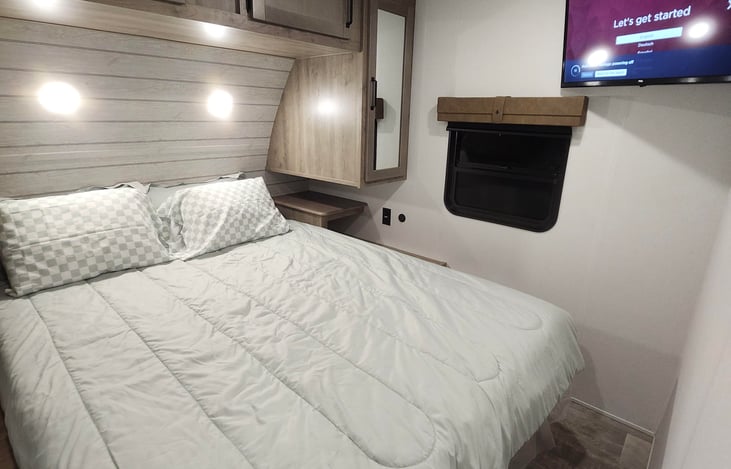 Cozy queen size bed.