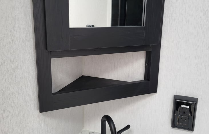 Bathroom wall cabinet above sink.