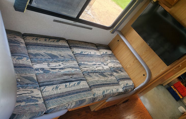 Dining room table folds into bed.