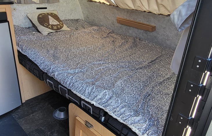 Dinning converts to a twin size bed with a 1.5 " memory foam topper.