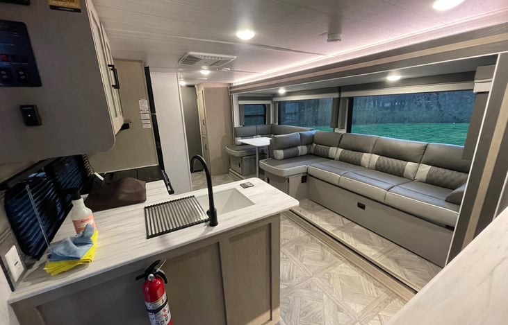 Main living area with couch and dinette.