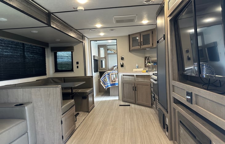 Full wrap around table-turns into bed
TV, DVD player, Fireplace below TV
Sound system inside/outside