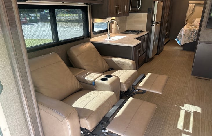 Two leather recliners directly across from a 47" TV....