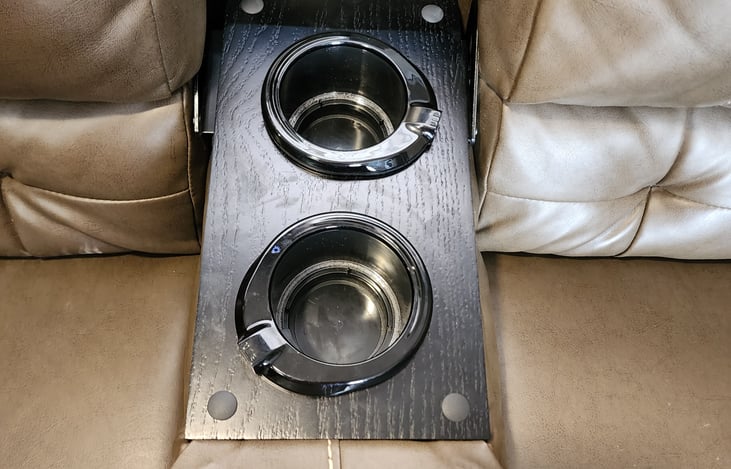 Cup holders on the couch with the lights off