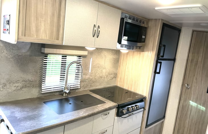 Kitchen sink, range, storage and combination convection range/microwave