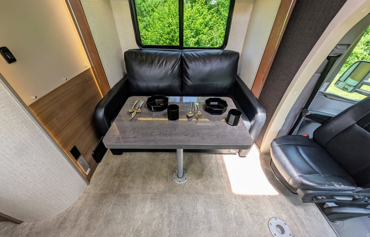 Classy and well-appointed interior with ample storage and premium materials throughout. Swing around captain's chairs and 2 positions for the dining table create a comfortable and flexible environment