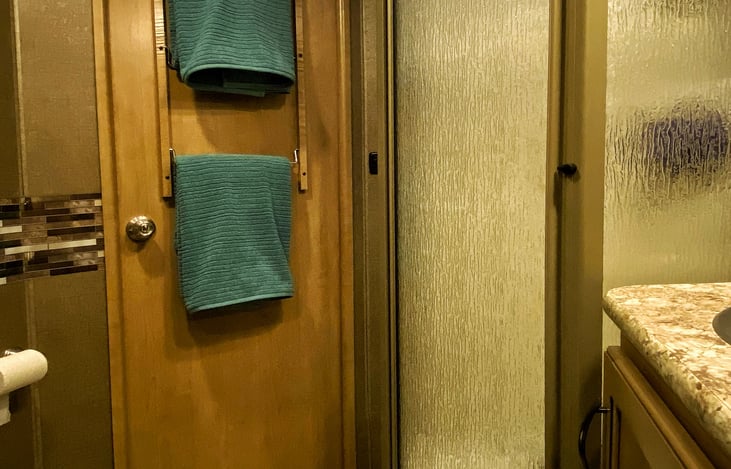 Inside the spacious bathroom! you’ll find an Oxygenics shower head for a refreshing shower while minimizing water usage.