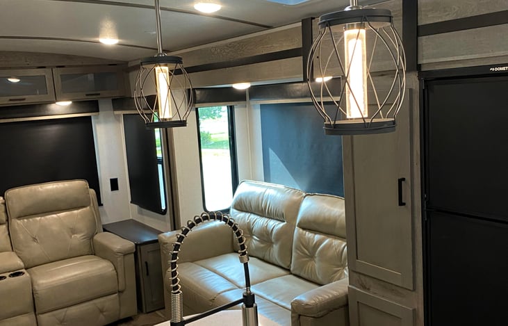 living area with a hideaway bed that sleeps two along with two nice leather recliners