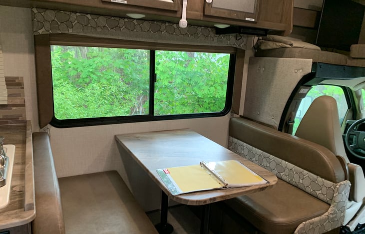 Dinette set that also converts into a bed and has seat belts for safe travelling