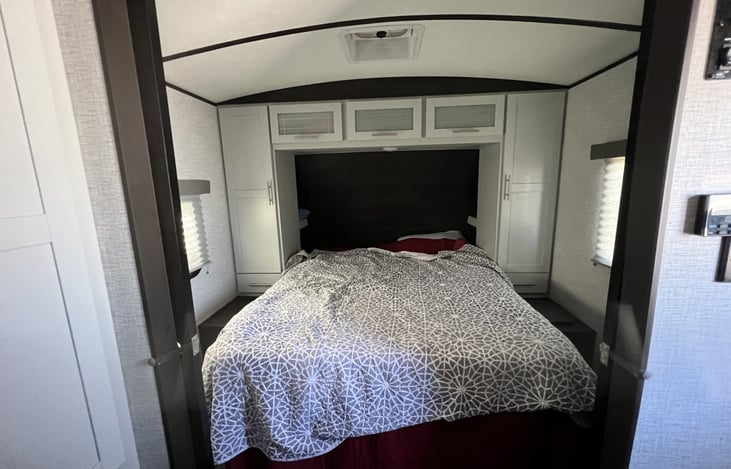 Full size residential queen bed with tempur pedic mattress. His and Hers closets with outlets and USB ports at headboard.