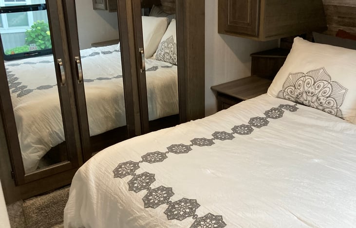 Master bedroom offers privacy and plenty of storage.