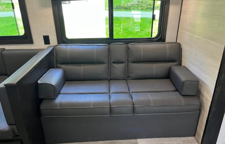 Jack-knife sofa that folds flat & can be used as a bed for a child up to about preteen.