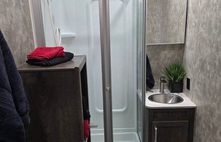 Cubby storage with towels.