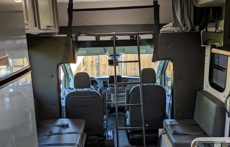 Ladder to over cab bed. Cargo net