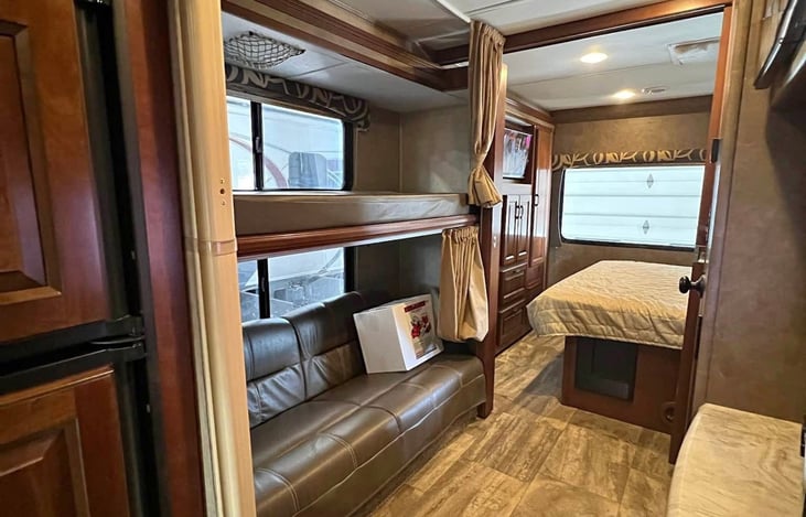 2 bunks in private area and back bedroom