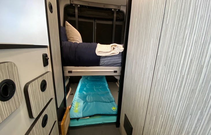 Sleeping arrangements for two adults and one child. Child mattress is 5 feet long.