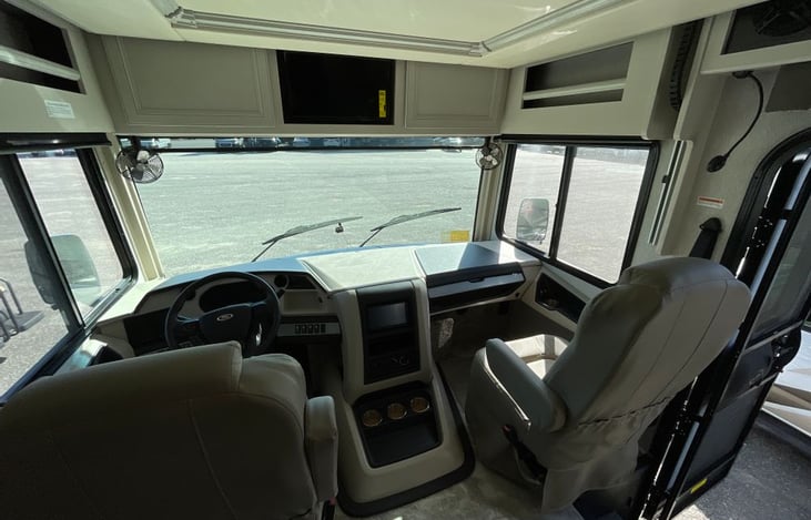 Passenger seat with tray, fan and light