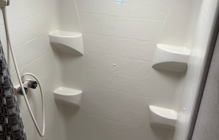 Spacious shower with hand held showerhead