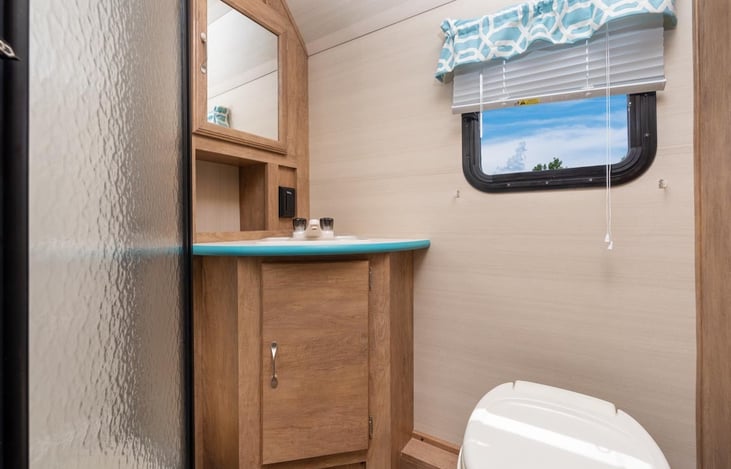 Generous room in the bathroom.  a 6' man can stand in the shower without ducking.