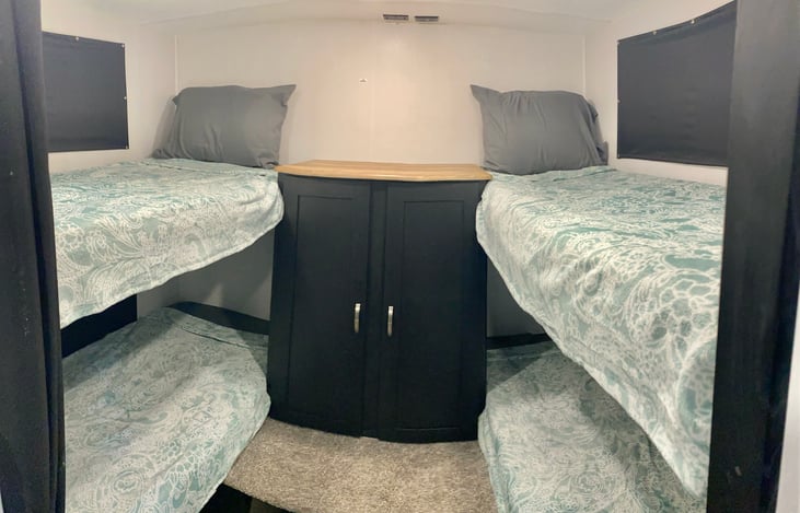 4 separate bunks and a curtain for privacy. Room also has USB ports and cable connection for tv on top of cabinet!