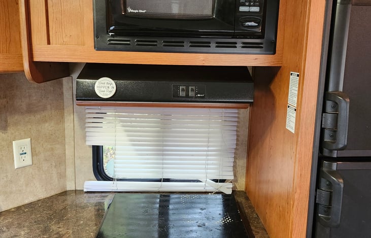 Stove, microwave and fridge/freezer.