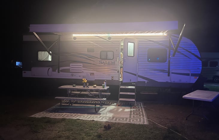 Exterior with lights. Outdoor rug included.