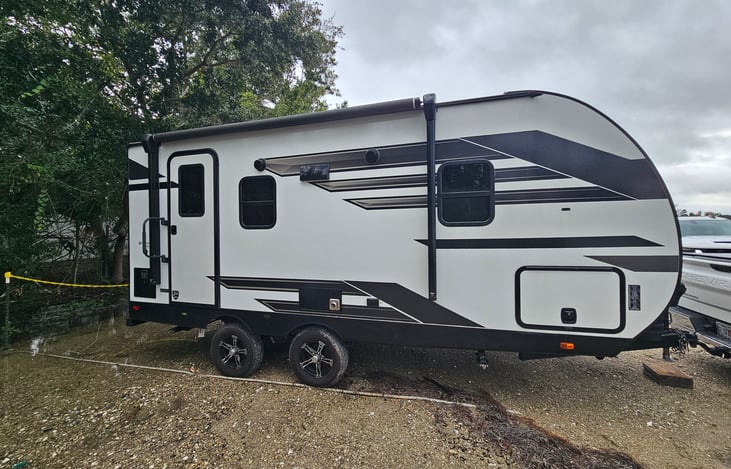 Spacious 168 sq ft layout with dual axles, wide-track suspension, and 30-amp power — built for smooth towing and comfortable living