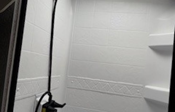 Shower with hot and cold water - headroom for tall guys too!