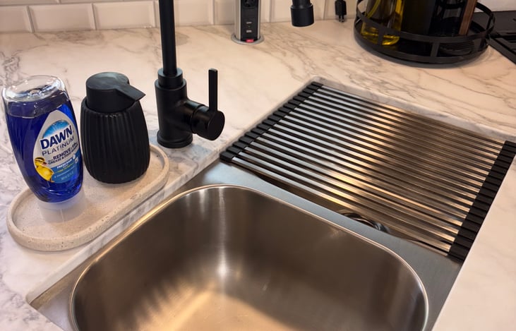 Double basin sink. Dish and hand soap provided.