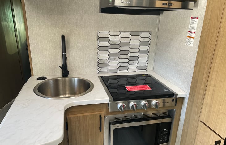 3-Burner stove with convection microwave oven. Overhead range