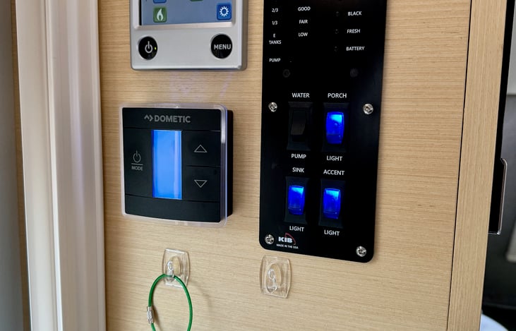 Control panels for Alde hot water & radiant heat, Dometic air conditioner, water tanks, and batteries.